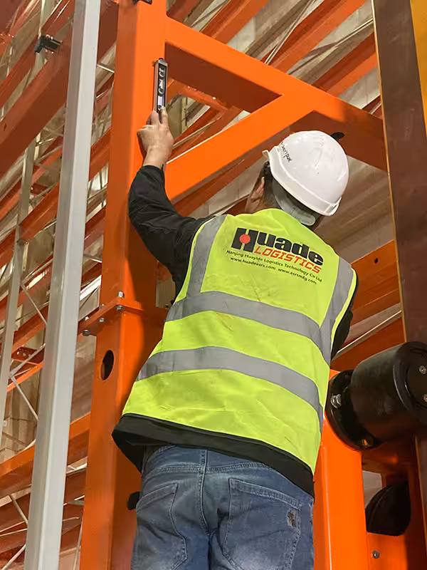 The stacker warehouse project engineer is testing