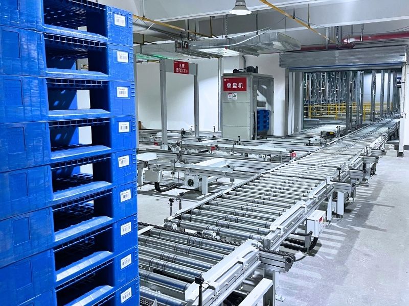 Automated warehousing ground conveyor system