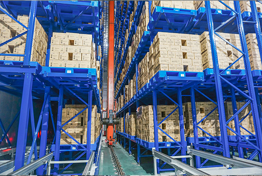 ASRS stacker crane operating inside a high-density automated cold storage warehouse for pallet storage