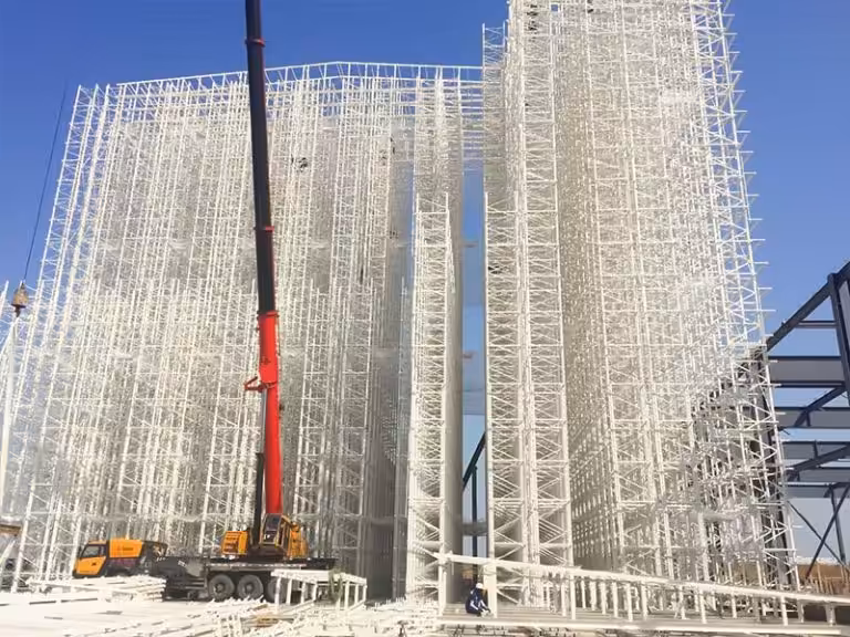 Rack supported building under construction with exposed racking structure before wall panel installation