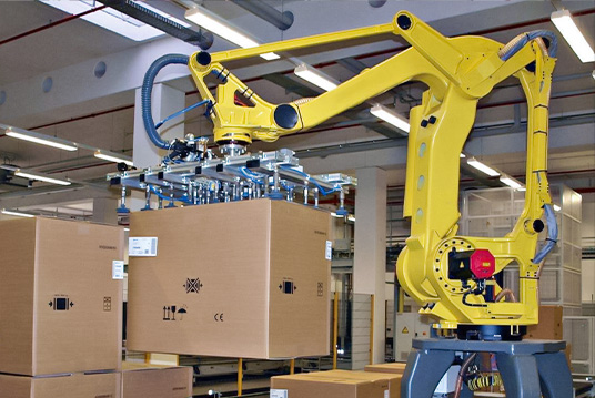 Industrial robotic arm using vacuum gripper for automated palletizing operations