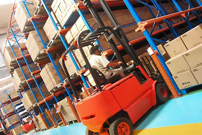 Drive in pallet racking system for high-density pallet storage.