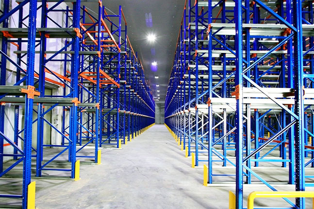 Drive-in pallet racking system for high-density pallet storage in a warehouse.