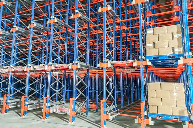 Pallet shuttle racking system using an automated shuttle for high-density pallet storage.