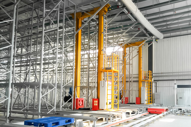 AS/RS stacker crane operating between high-bay pallet racks