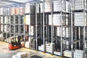 Forklift operating inside a drive-in pallet racking system