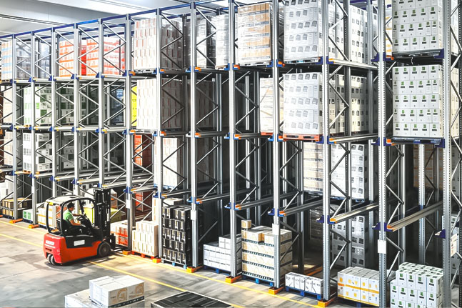 Forklift operating inside a drive-in pallet racking system