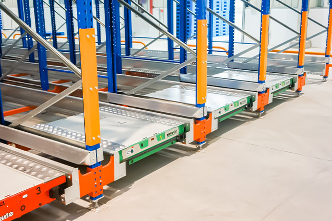 Pallet shuttle operating inside a high-density pallet racking system