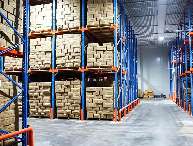 Pallet racking with an open structure for airflow and pallet storage in cold storage.