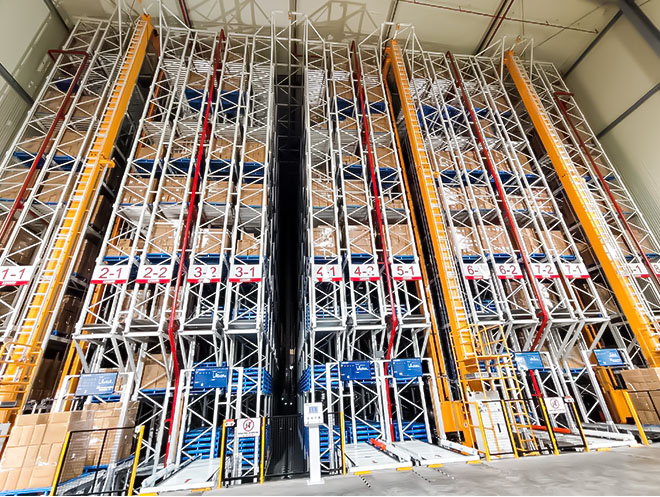 Straight-rail automated stacker and ASRS crane with high-bay racking in a paper products warehouse in Vietnam